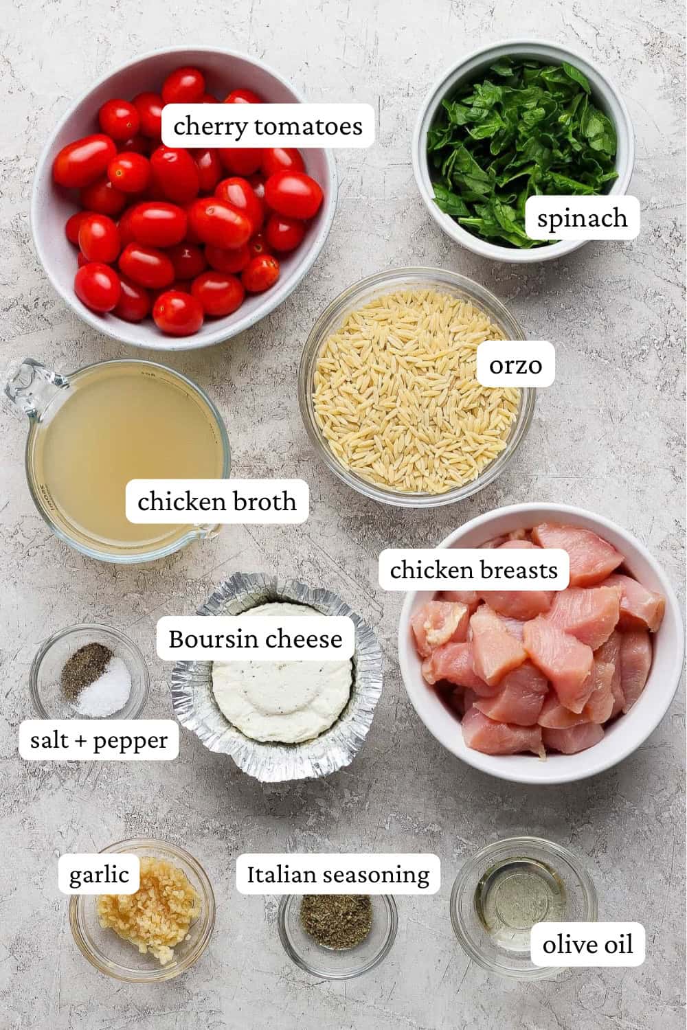 Ingredients for boursin orzo with chicken in separate bowls with labels.
