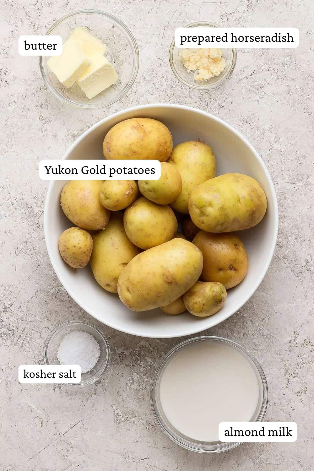 Horseradish mashed potatoes ingredients in separate bowls with labels.