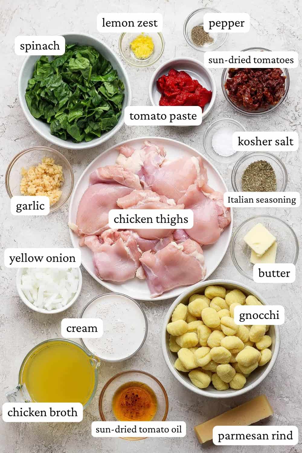 Ingredients for marry me chicken gnocchi soup in separate bowls with labels.