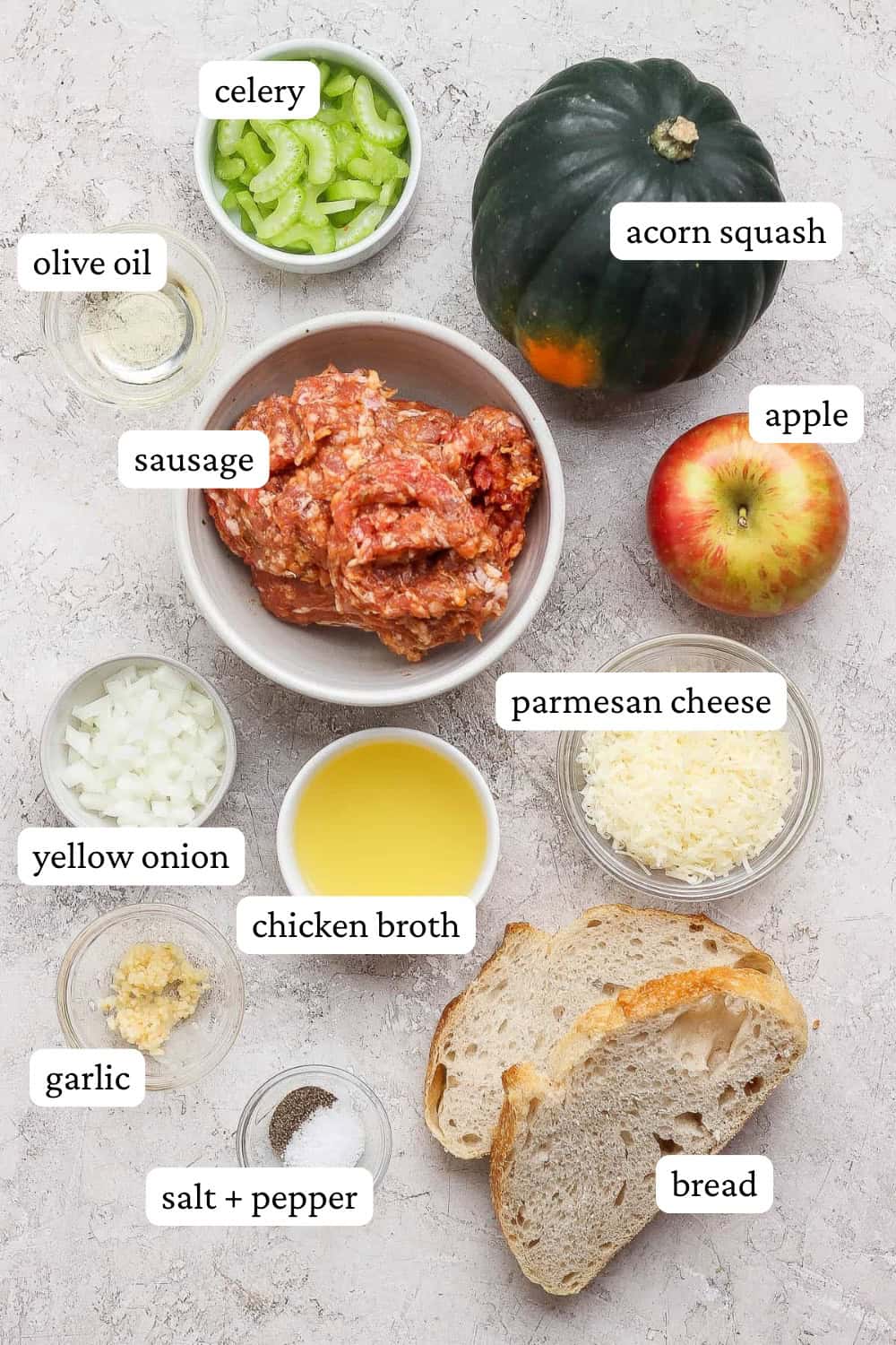 Sausage and apple stuffed acorn squash ingredients in separate bowls with labels.