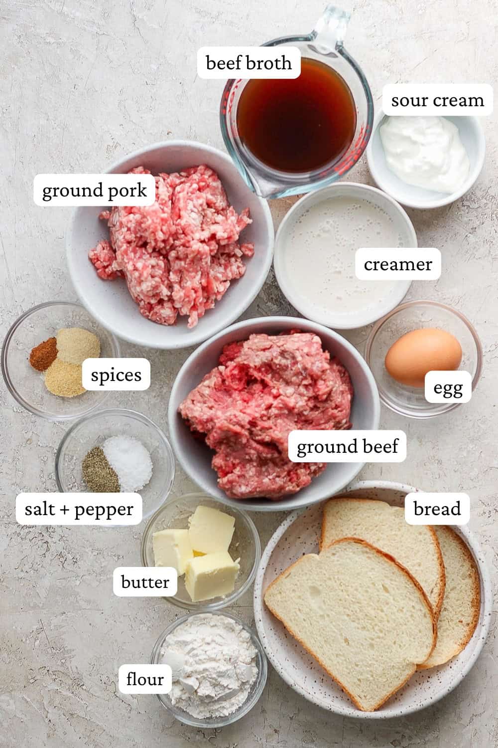 Ingredients for Swedish meatballs in separate bowls with labels.