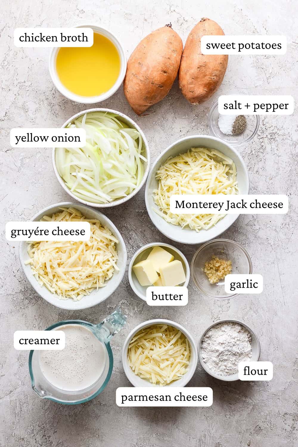 Ingredients for sweet potato au gratin in separate bowls with labels.