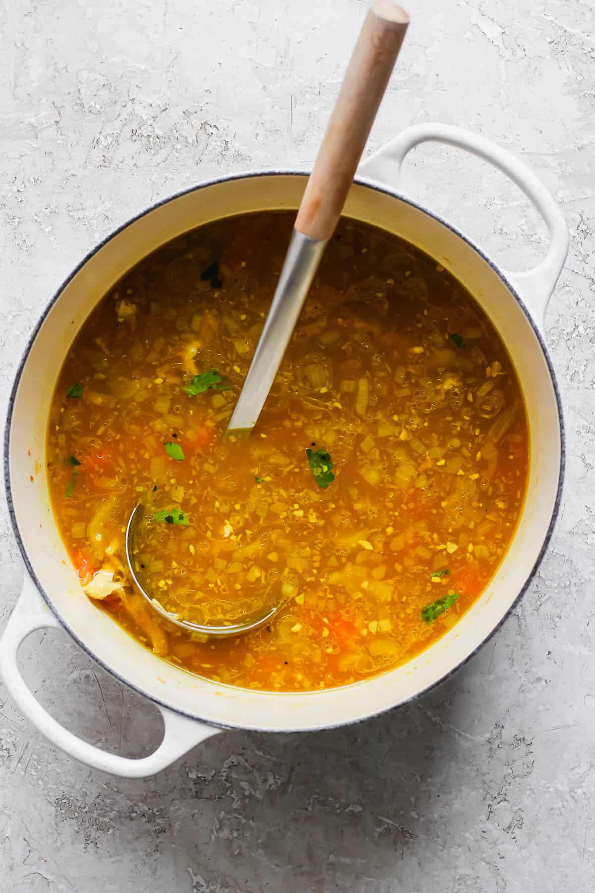 Turmeric chicken soup in a dutch oven without orzo.
